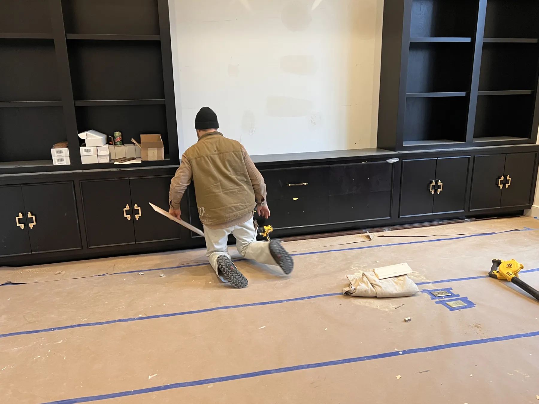 Finishing the black built-ins on site