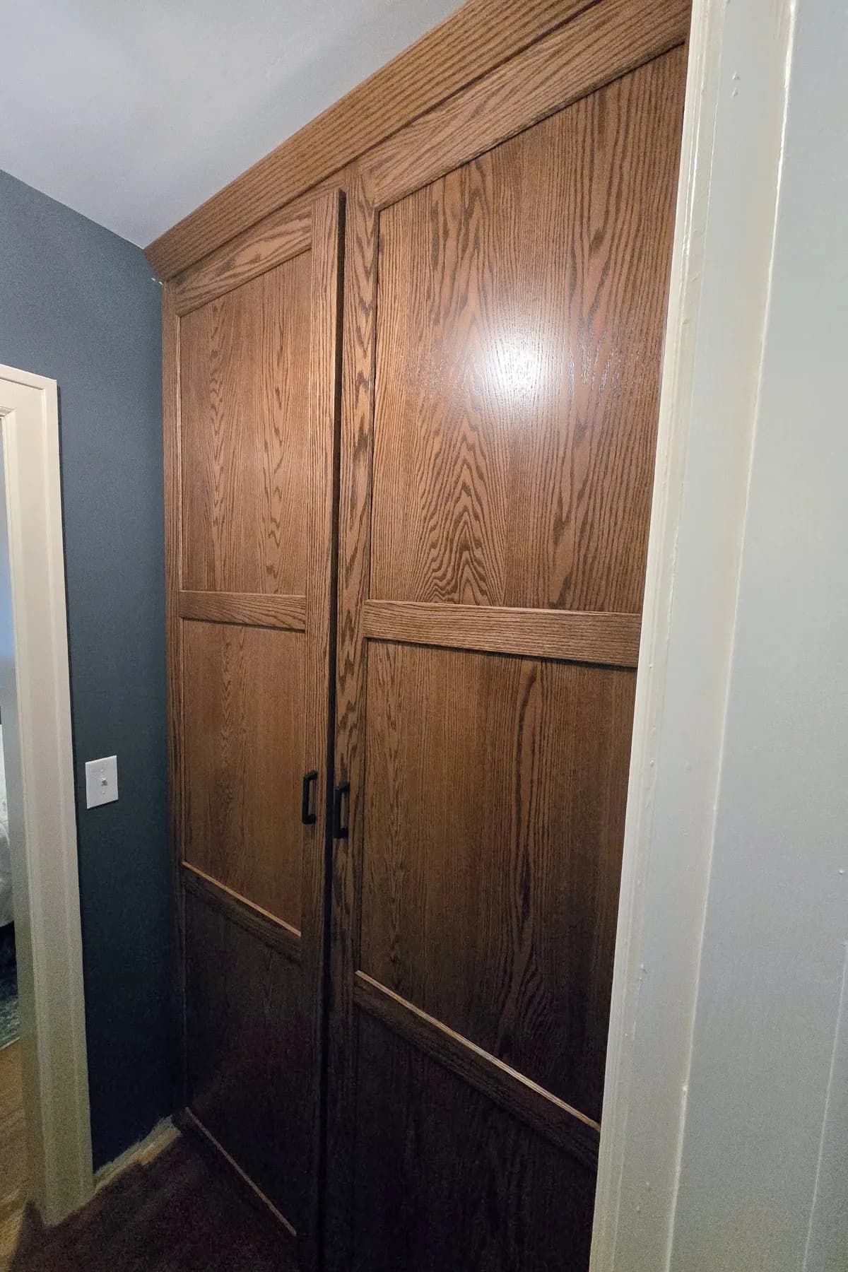 Tall oak wardrobe doors with a matched grain pattern