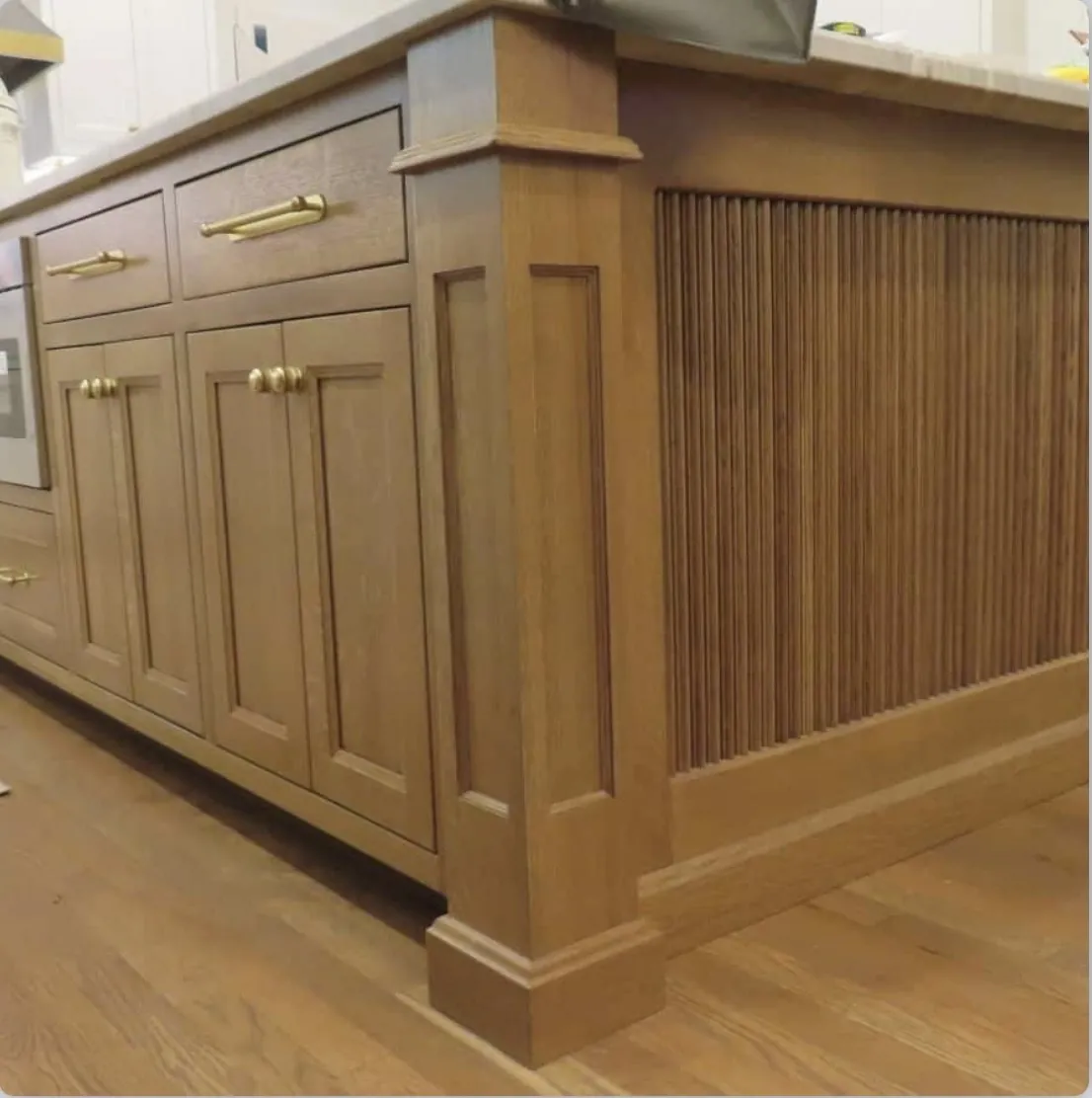 Painted island with a reeded end panel and brass pulls