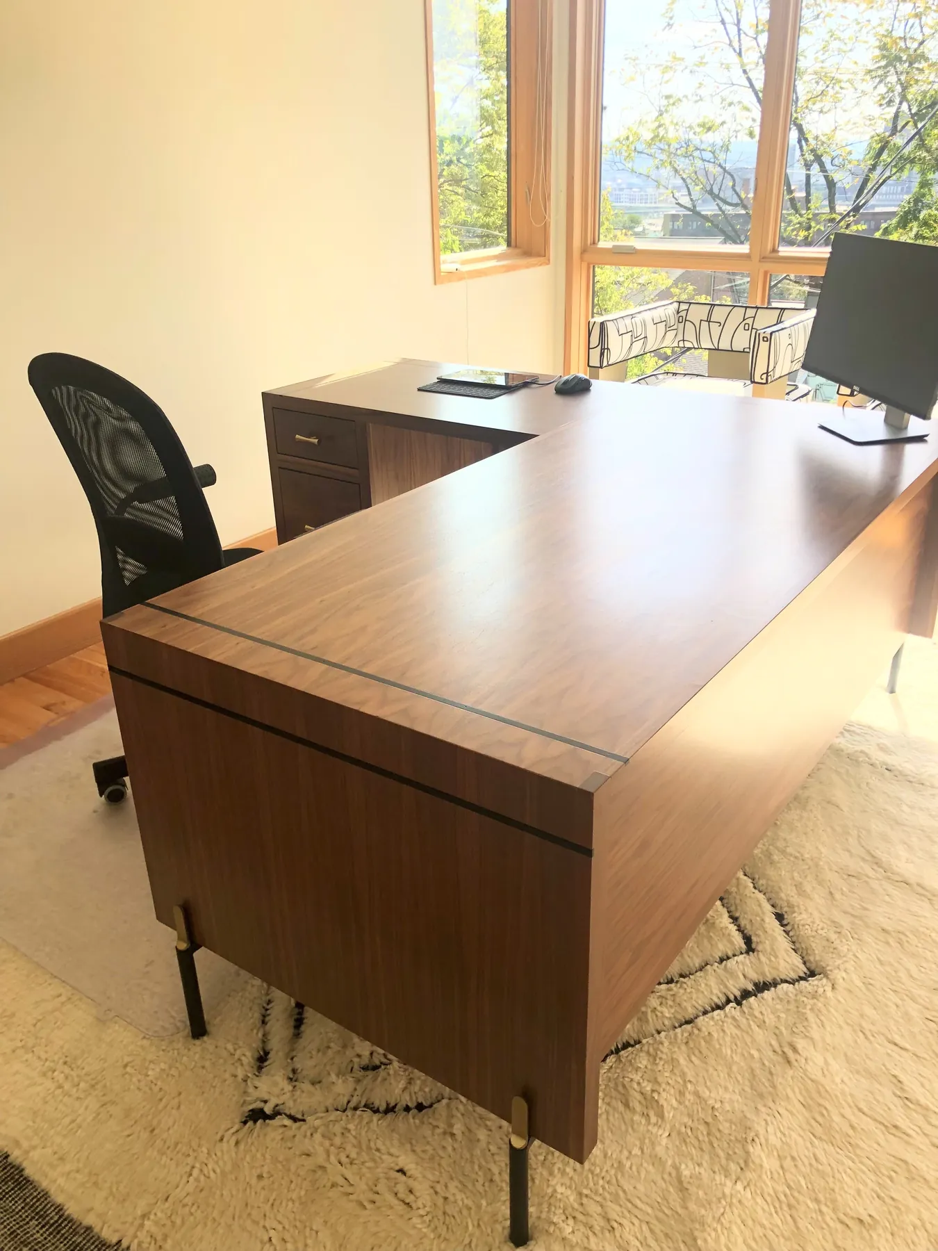 Stained desk return with a file drawer, seen from the doorway