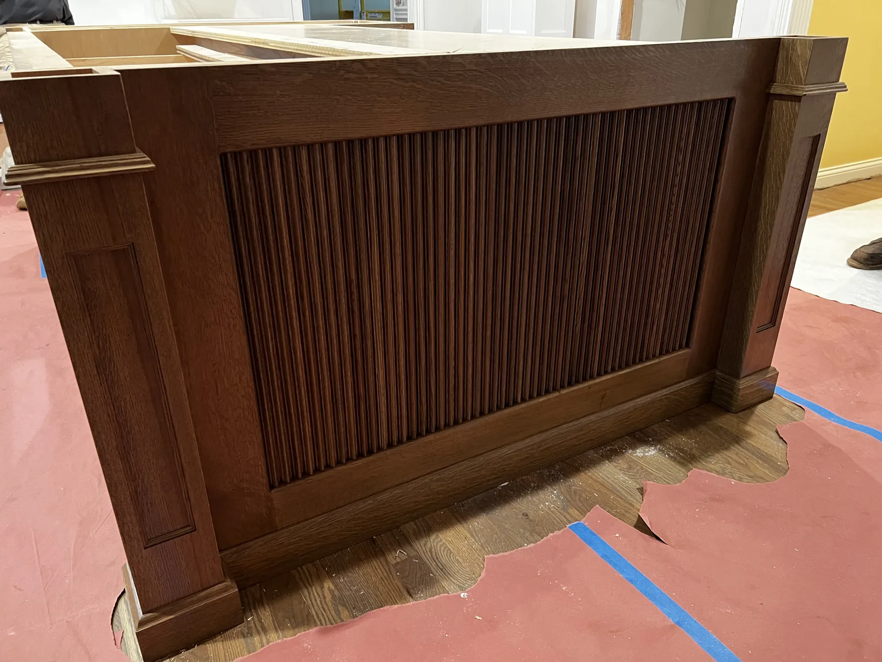 Reeded walnut island panel finished in the shop before install