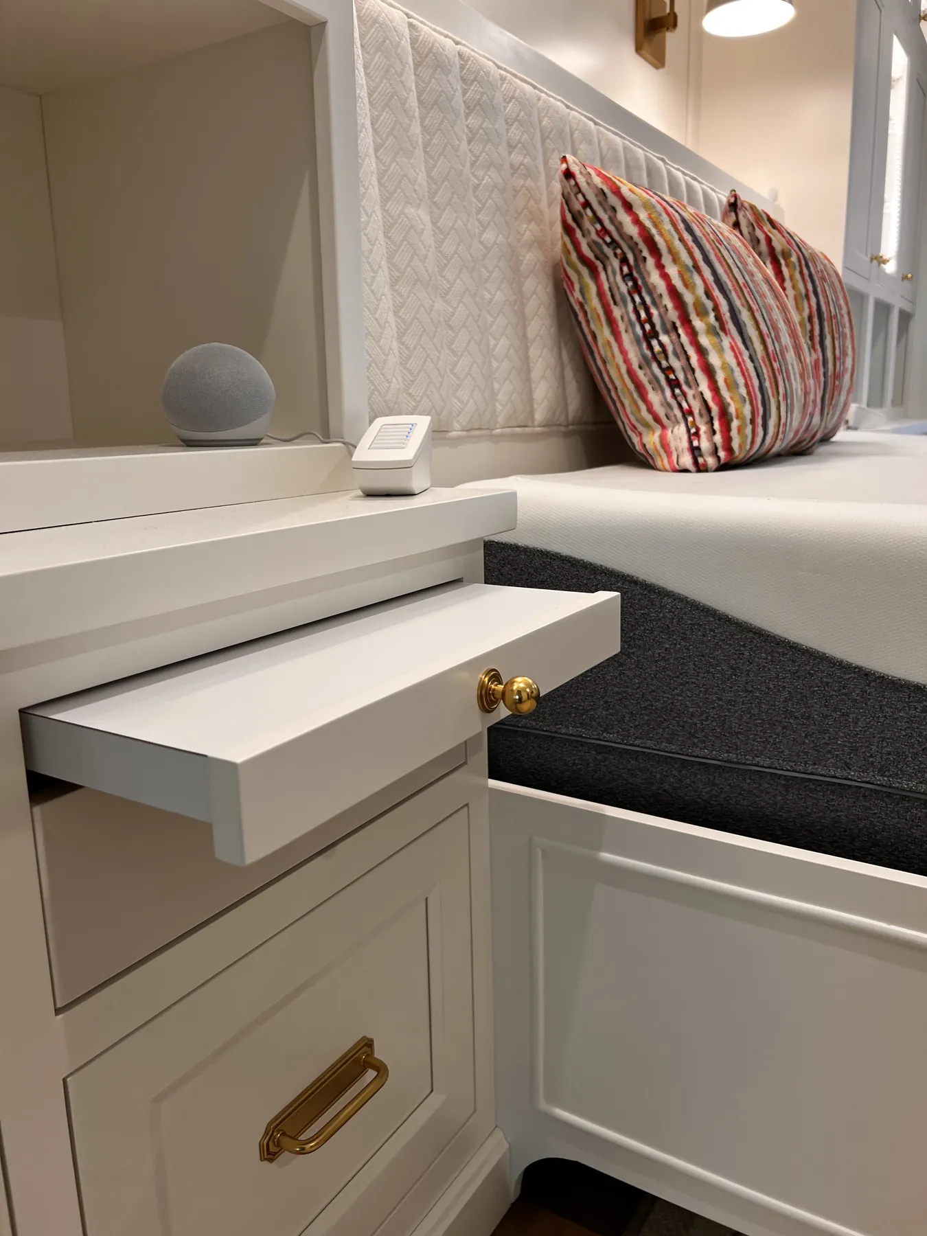 Pull-out tray sliding from the painted window seat