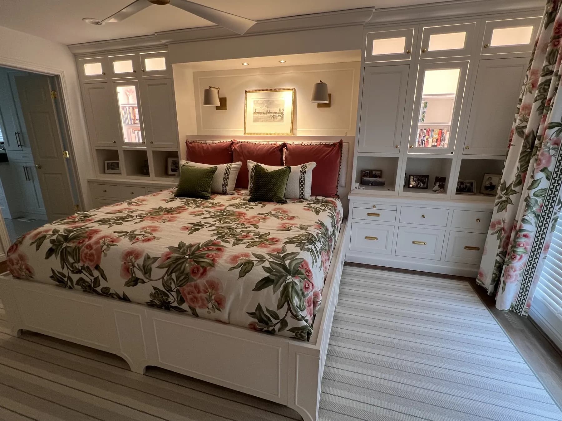 Bedroom with painted built-ins wrapping the bed and lit display niches